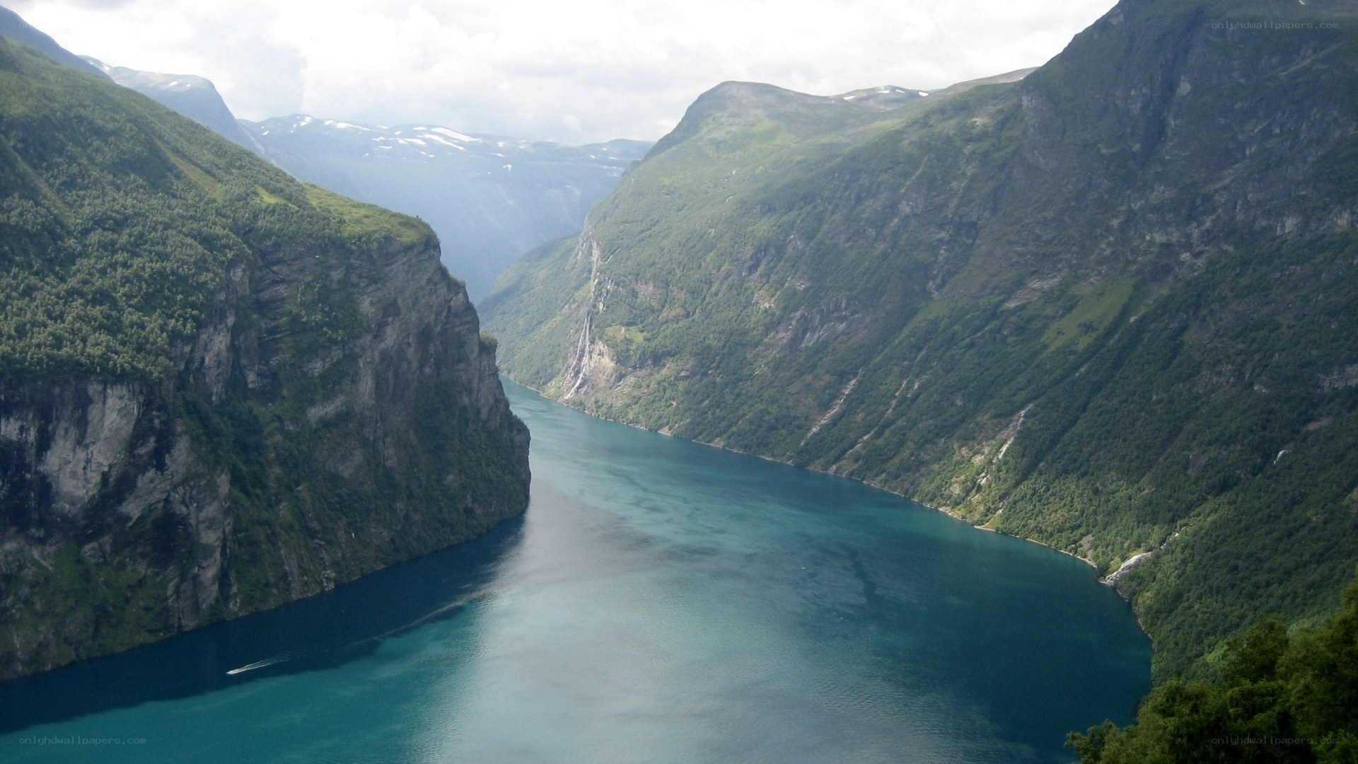 deep fjord between green mountains