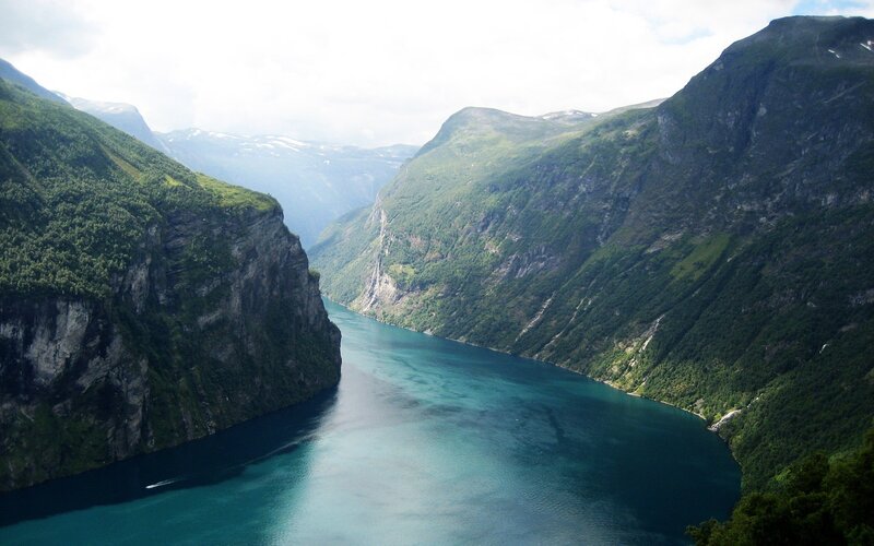 deep fjord between green mountains
