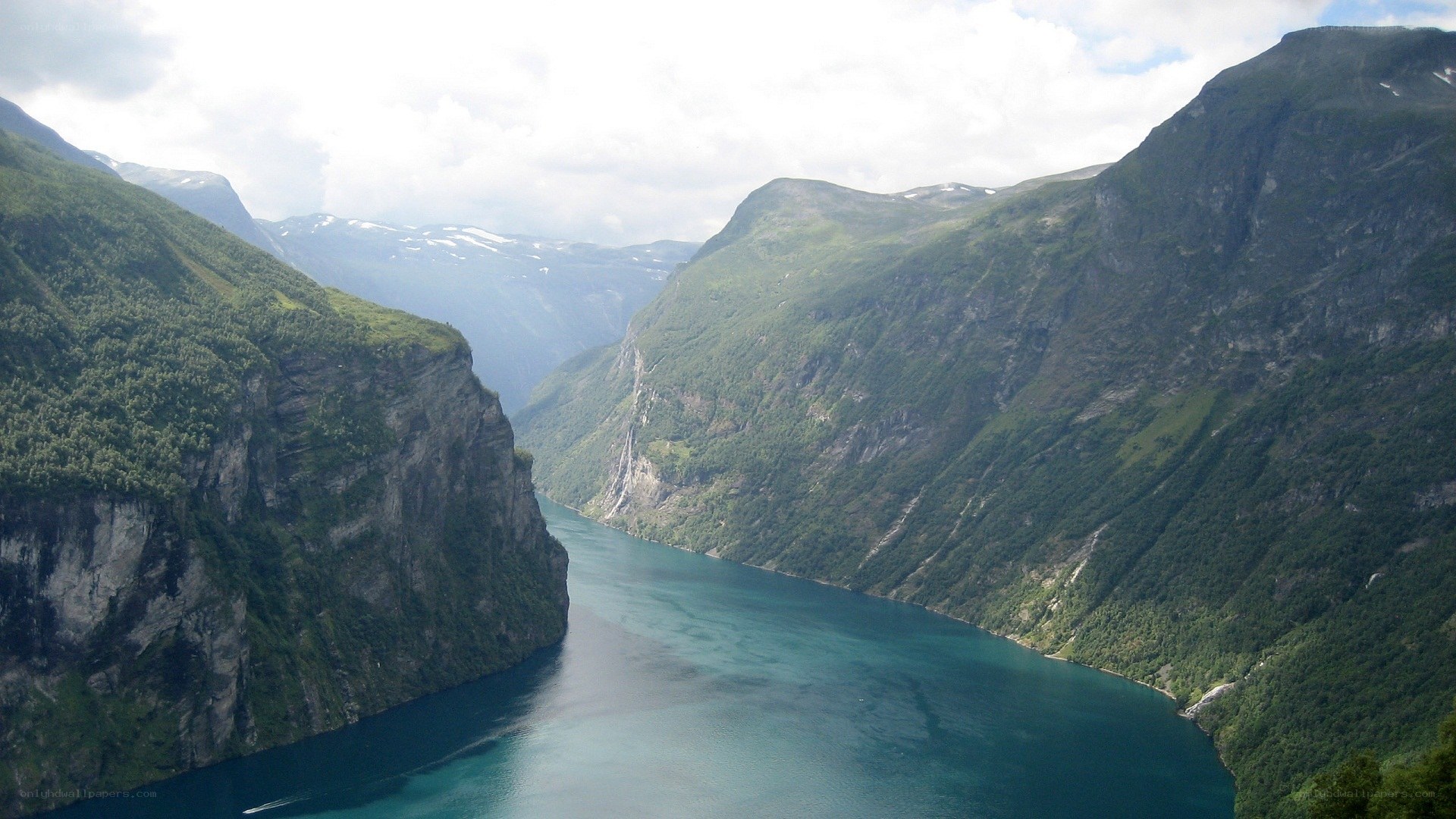 deep fjord between green mountains