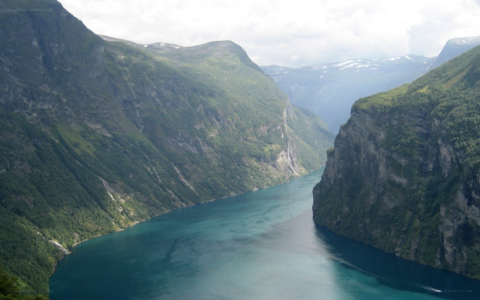 deep fjord between green mountains