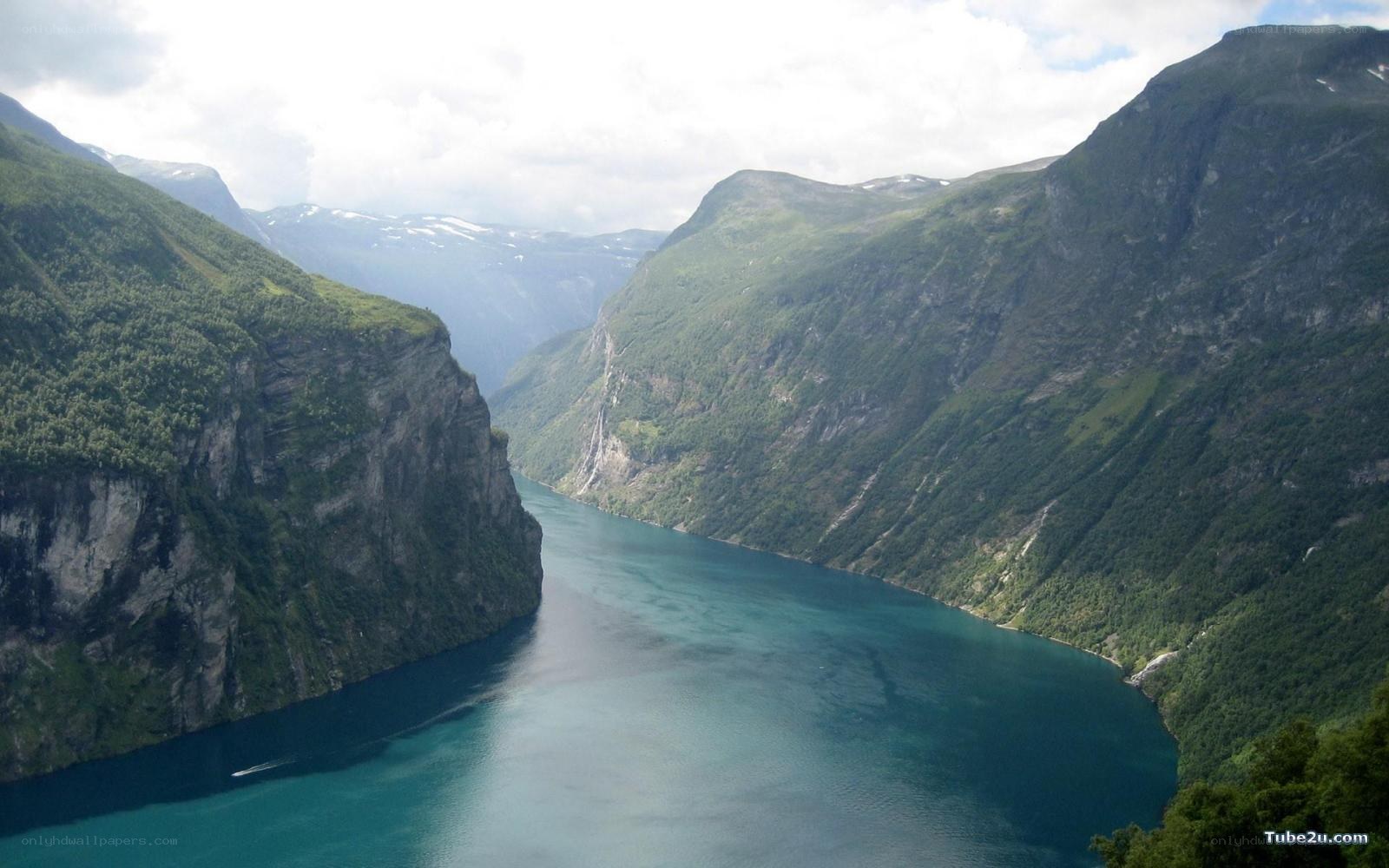 deep fjord between green mountains