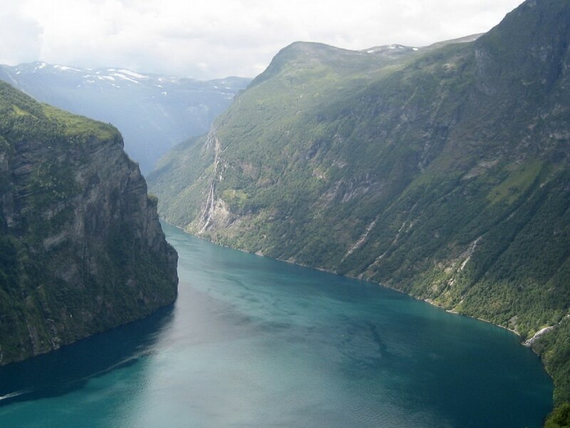 deep fjord between green mountains