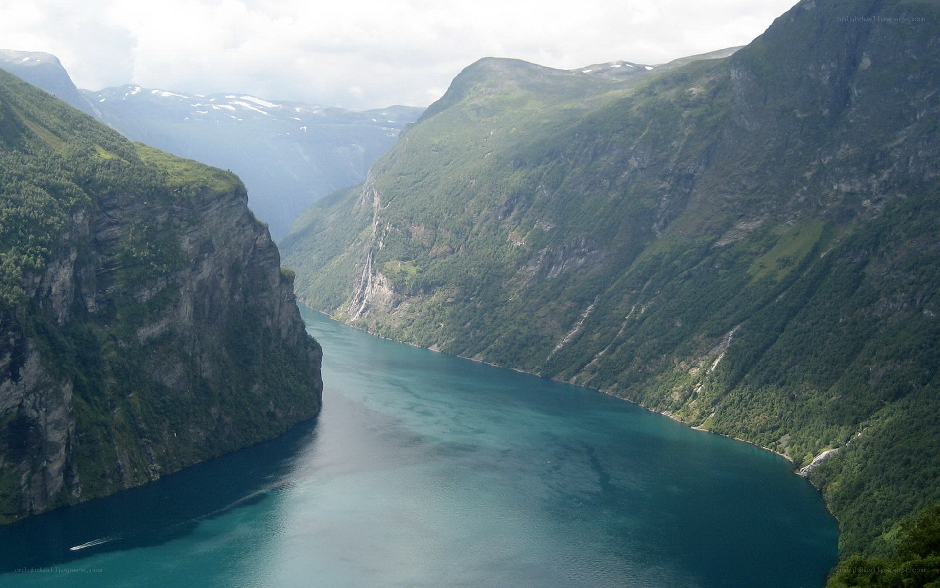 deep fjord between green mountains