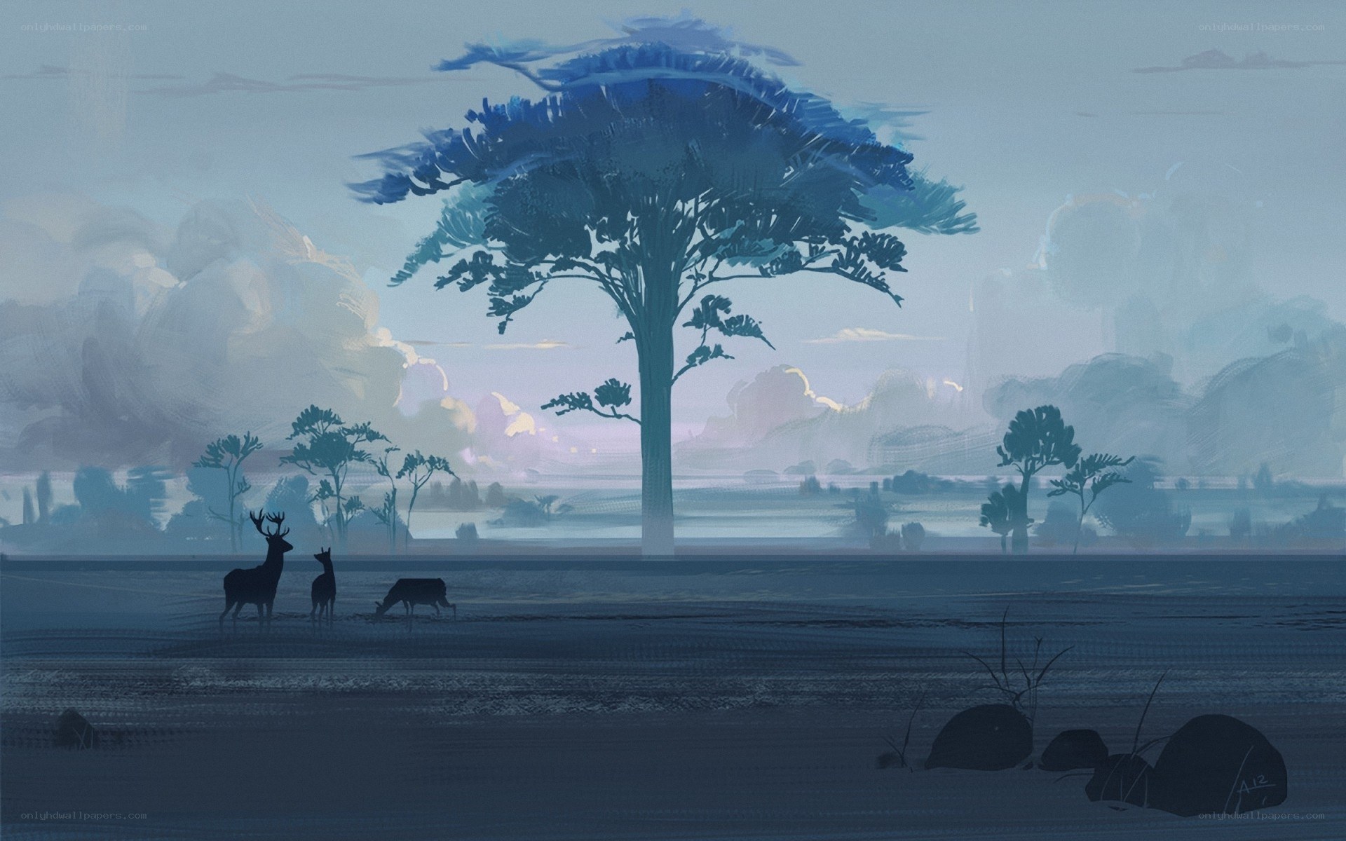 Deer under a large tree