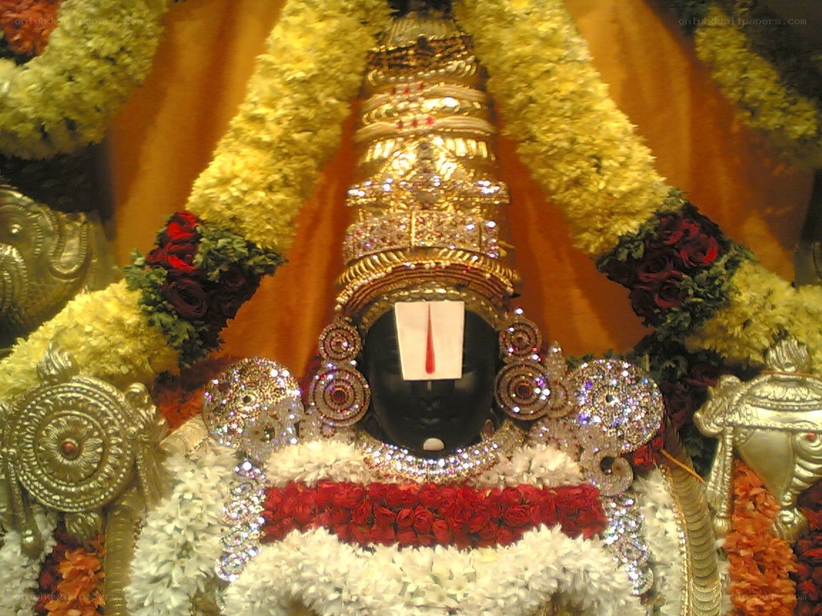 deity adorned with flowers and jewels