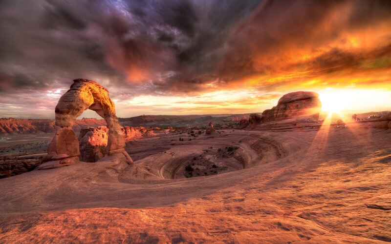 Delicate Arch at Sunset — Orange, Dramatic, Photograph, Rock Formation