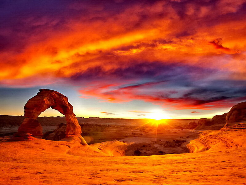 Delicate Arch at Sunset — Orange, Dramatic