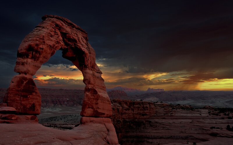 Delicate Arch at Sunset — Red, Dramatic, Photograph, Desert Landscape