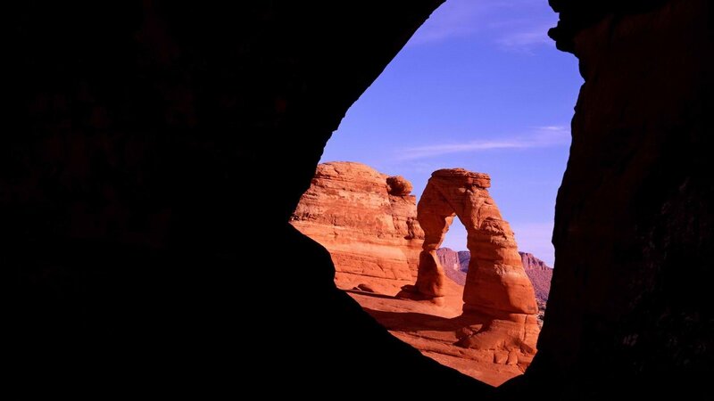 Delicate Arch through cave opening