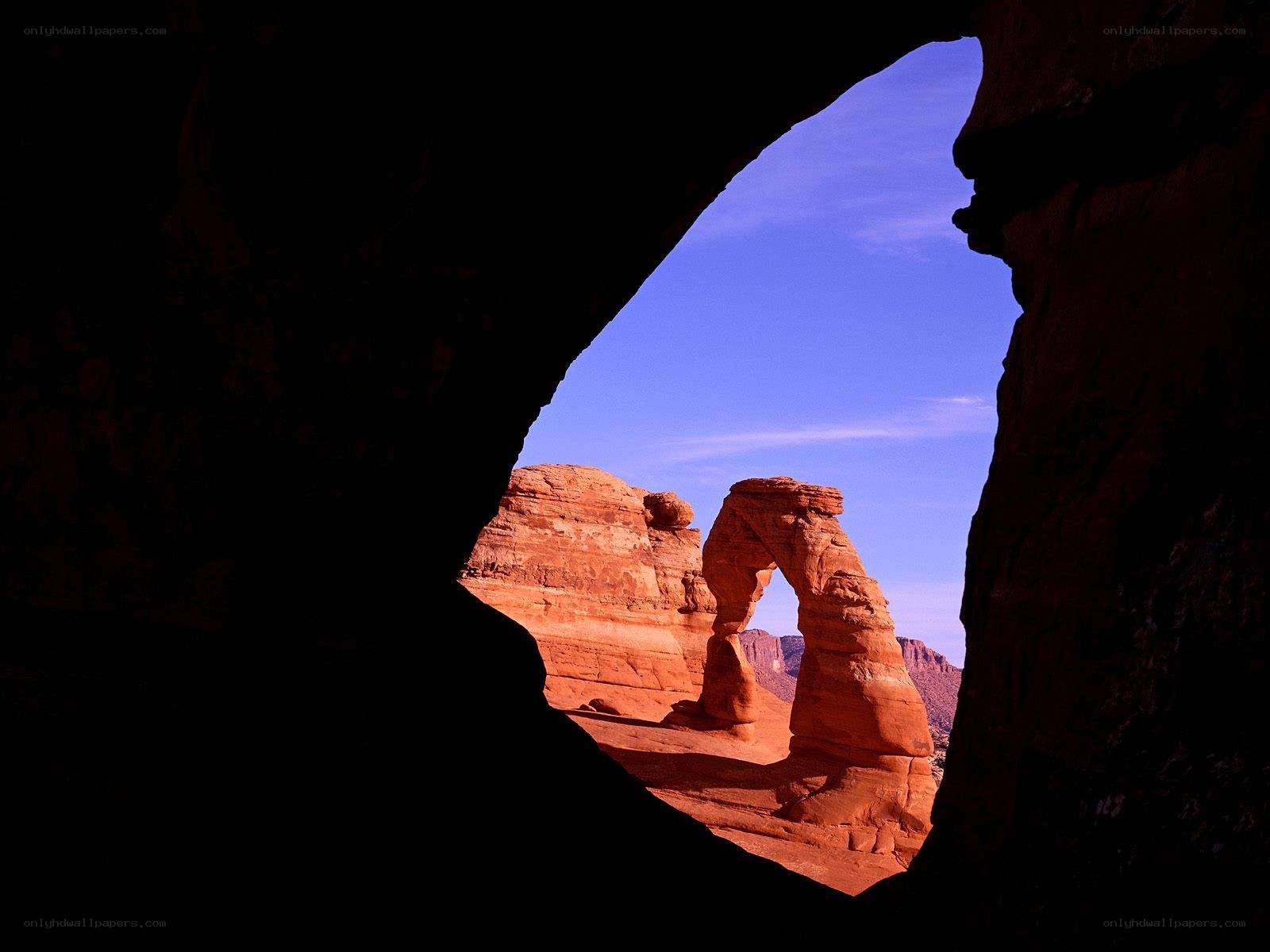 Delicate Arch through cave opening