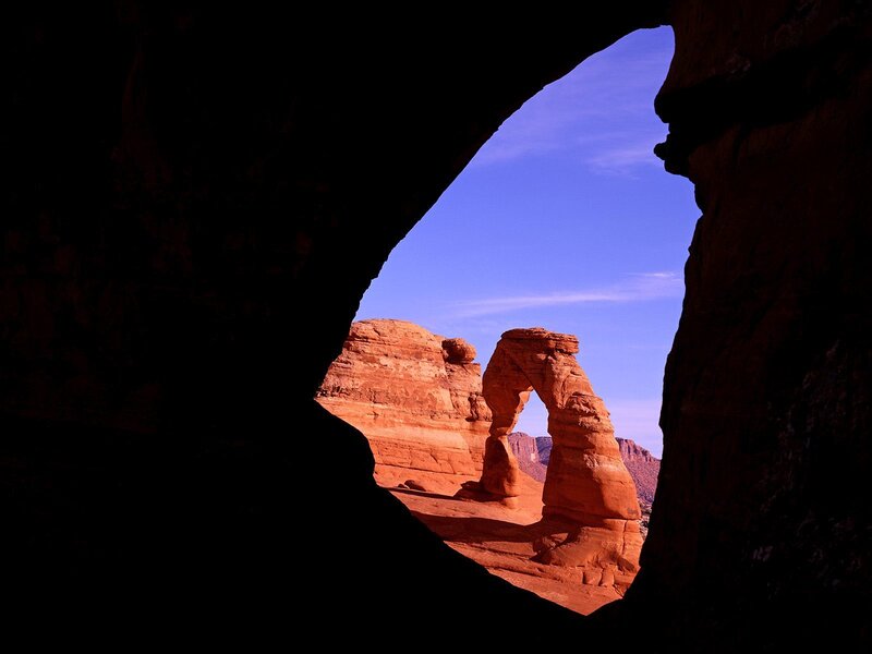 Delicate Arch Through Cave — Red