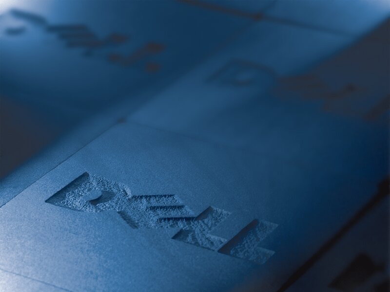 Dell logo embossed on blue surface