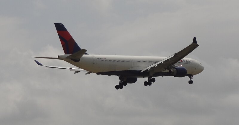 Delta Air Lines Airplane — White, Overcast