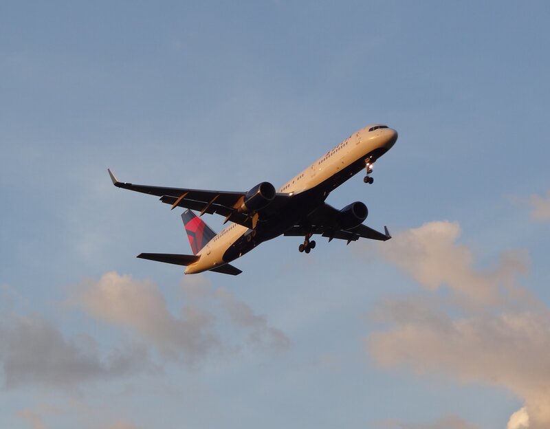 Delta Airplane in Flight — Blue, Dramatic