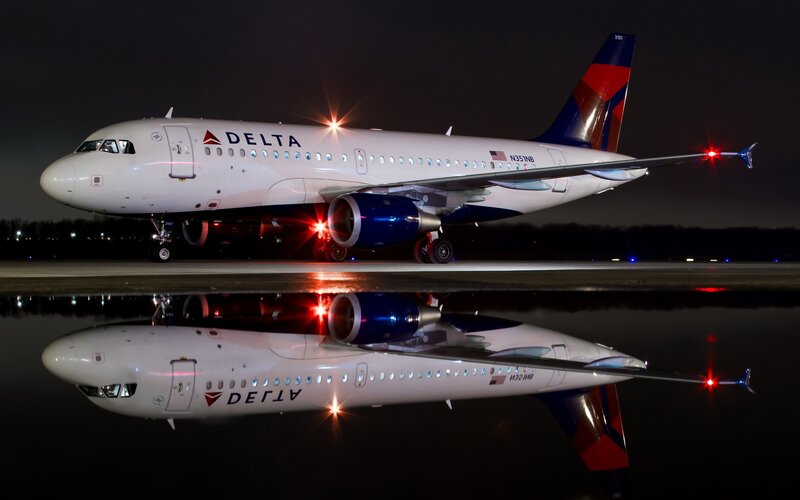 Delta Airplane on Tarmac — White, Dramatic