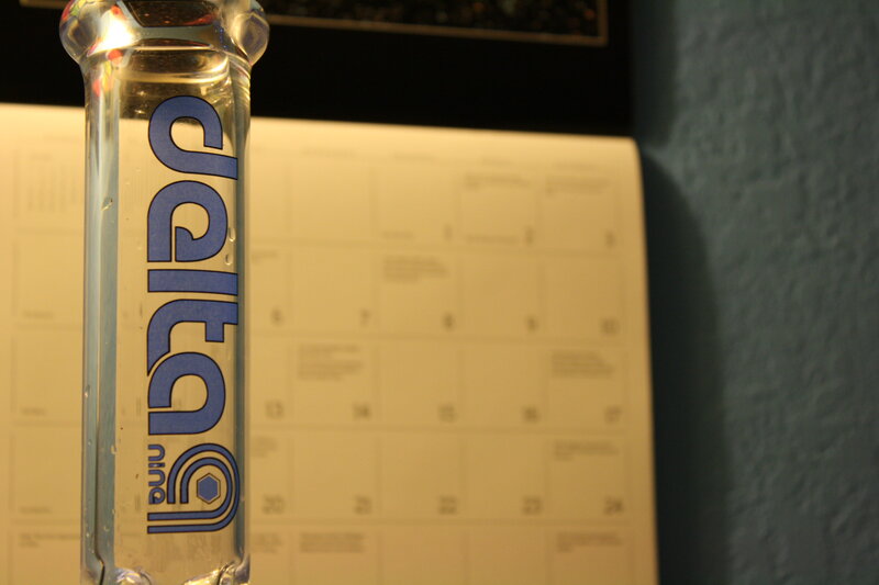 Delta water bottle in front of calendar