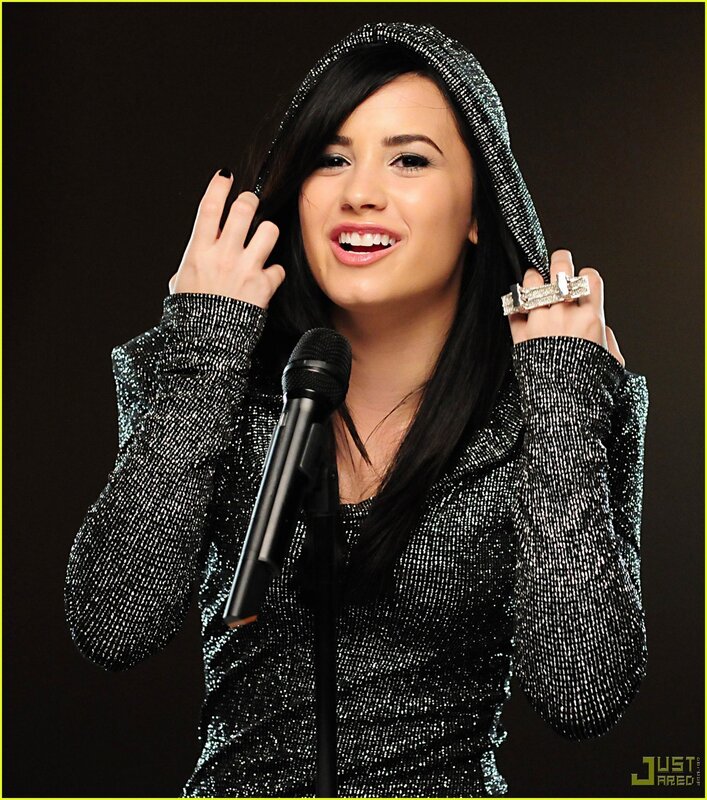 Demi Lovato at a microphone