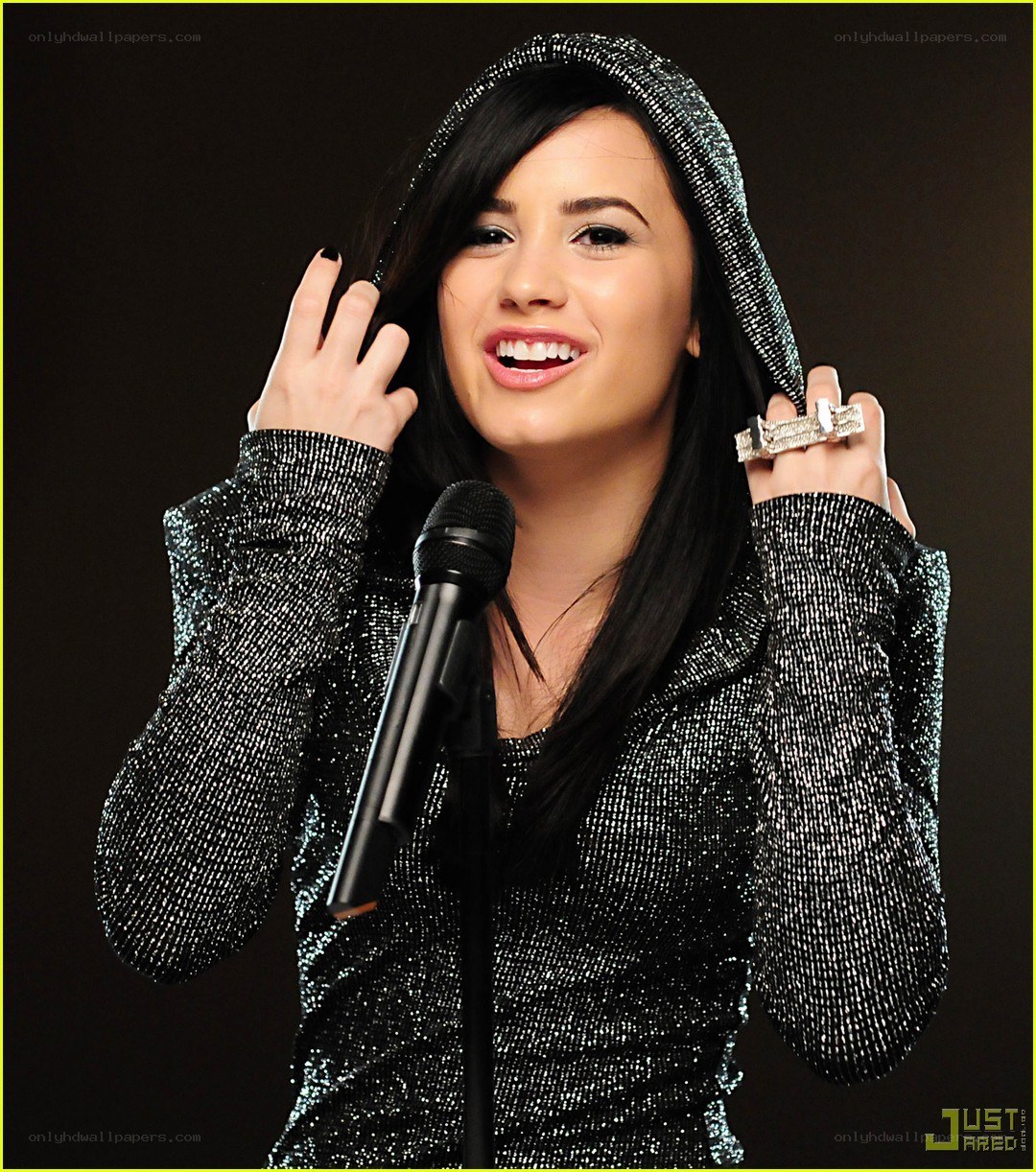 Demi Lovato at a microphone