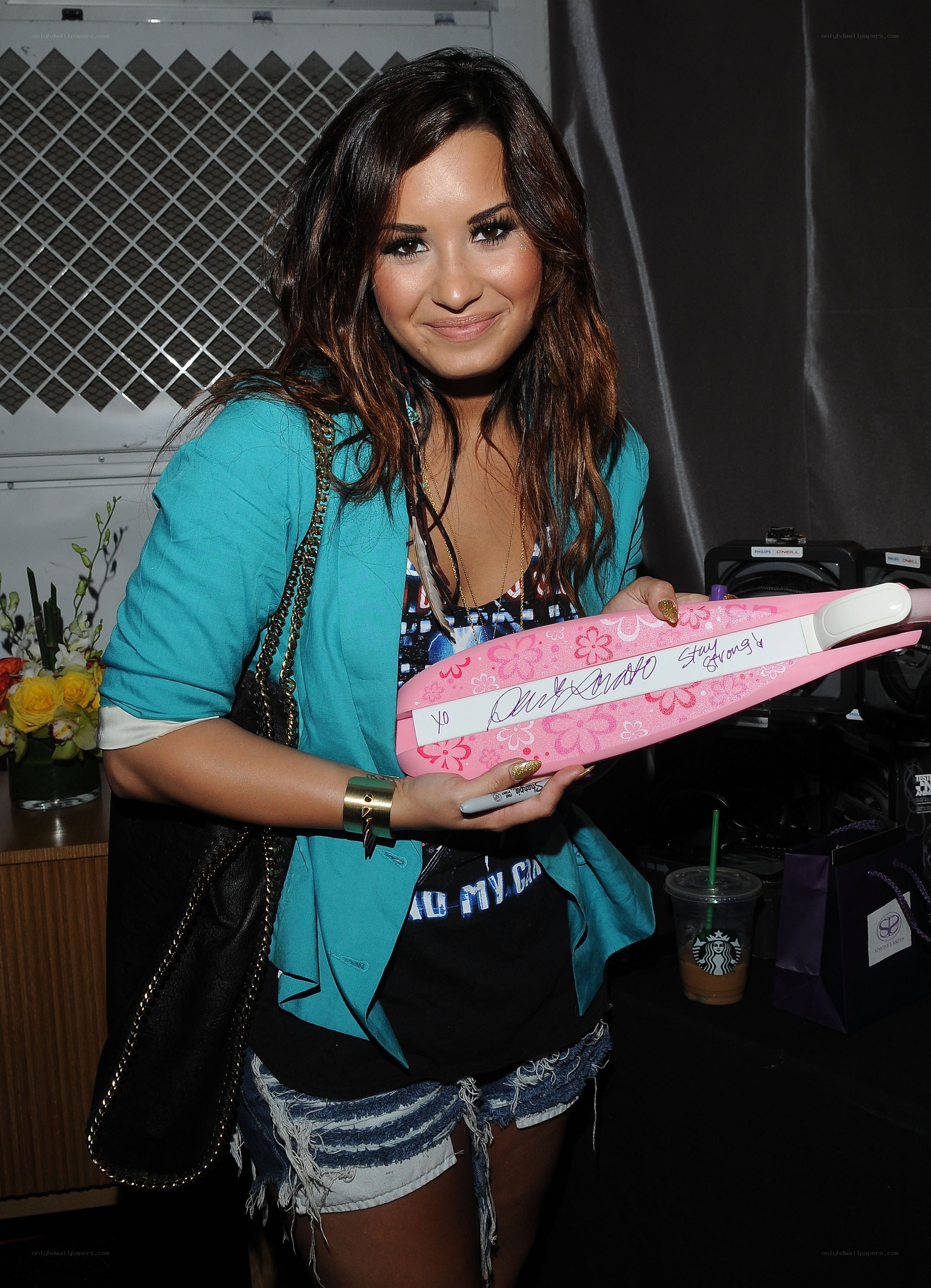 Demi Lovato holding a gift