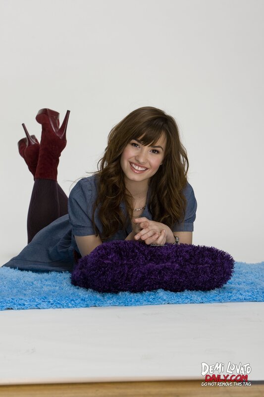 Demi Lovato on a blue rug