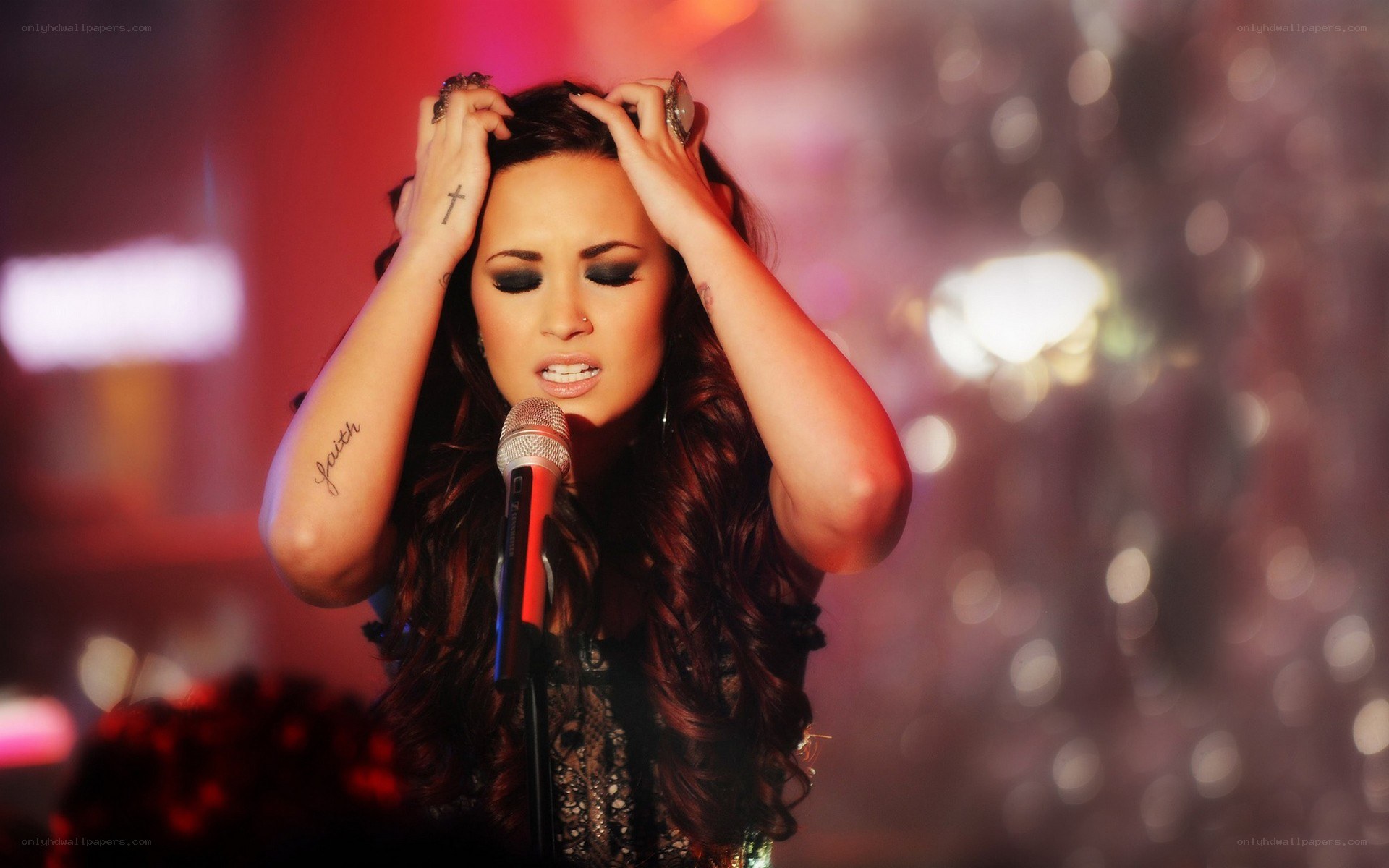 Demi Lovato singing on stage