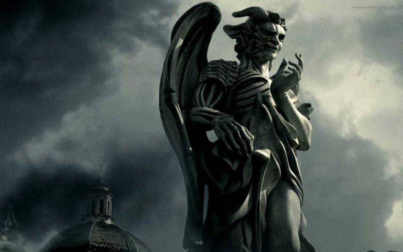 demon angel statue in storm