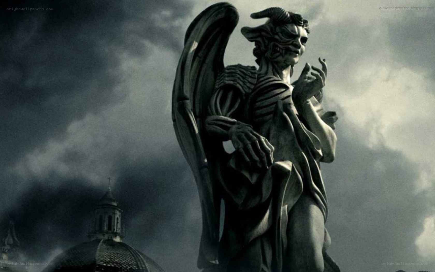 demon angel statue in storm