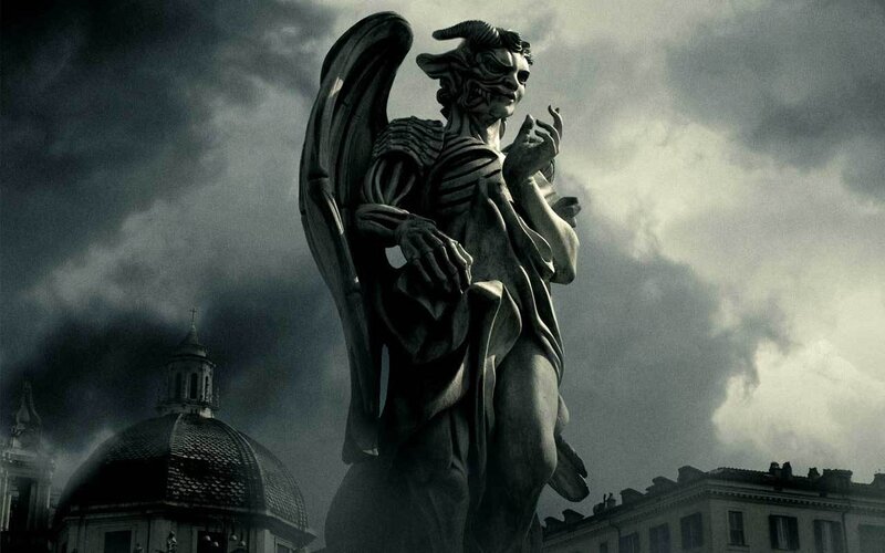 demon statue in stormy city