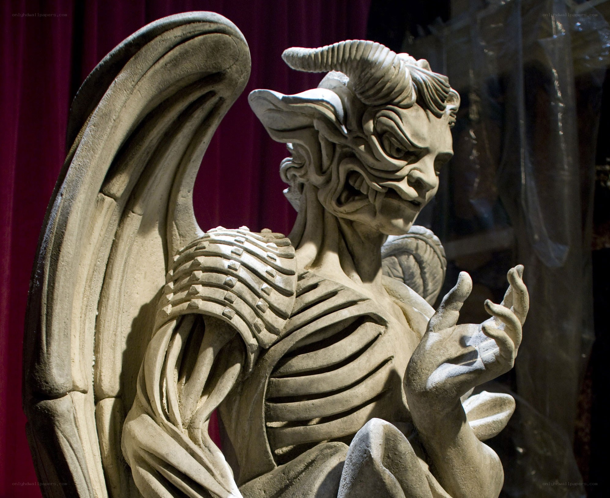 demon statue with wings
