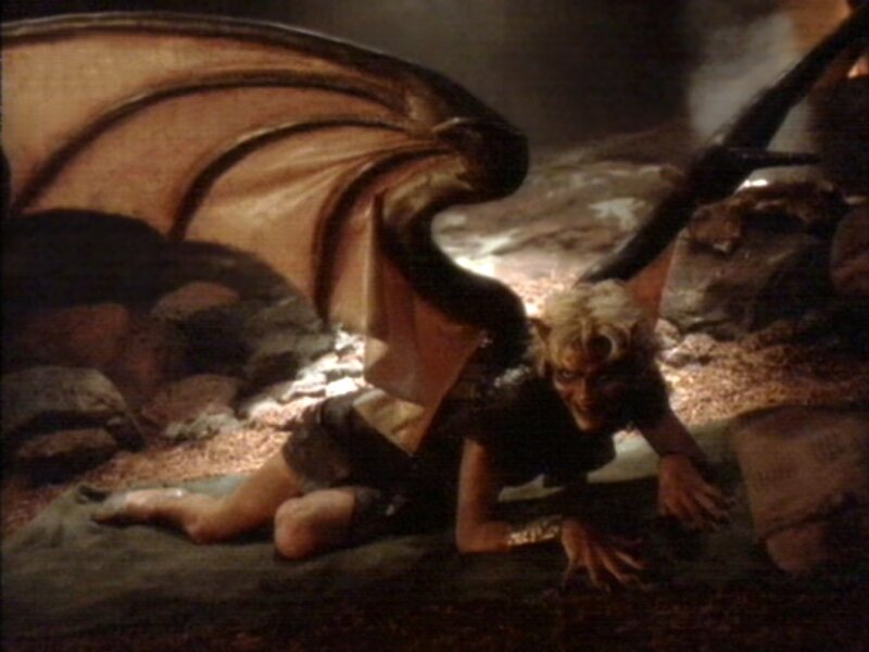 demon with wings on ground