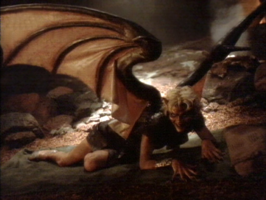 demon with wings on ground