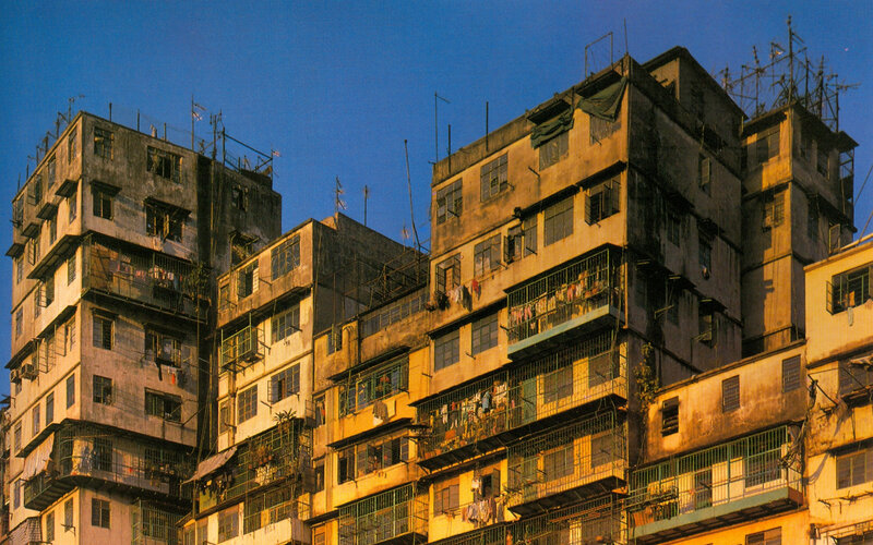 Dense apartment buildings at dusk