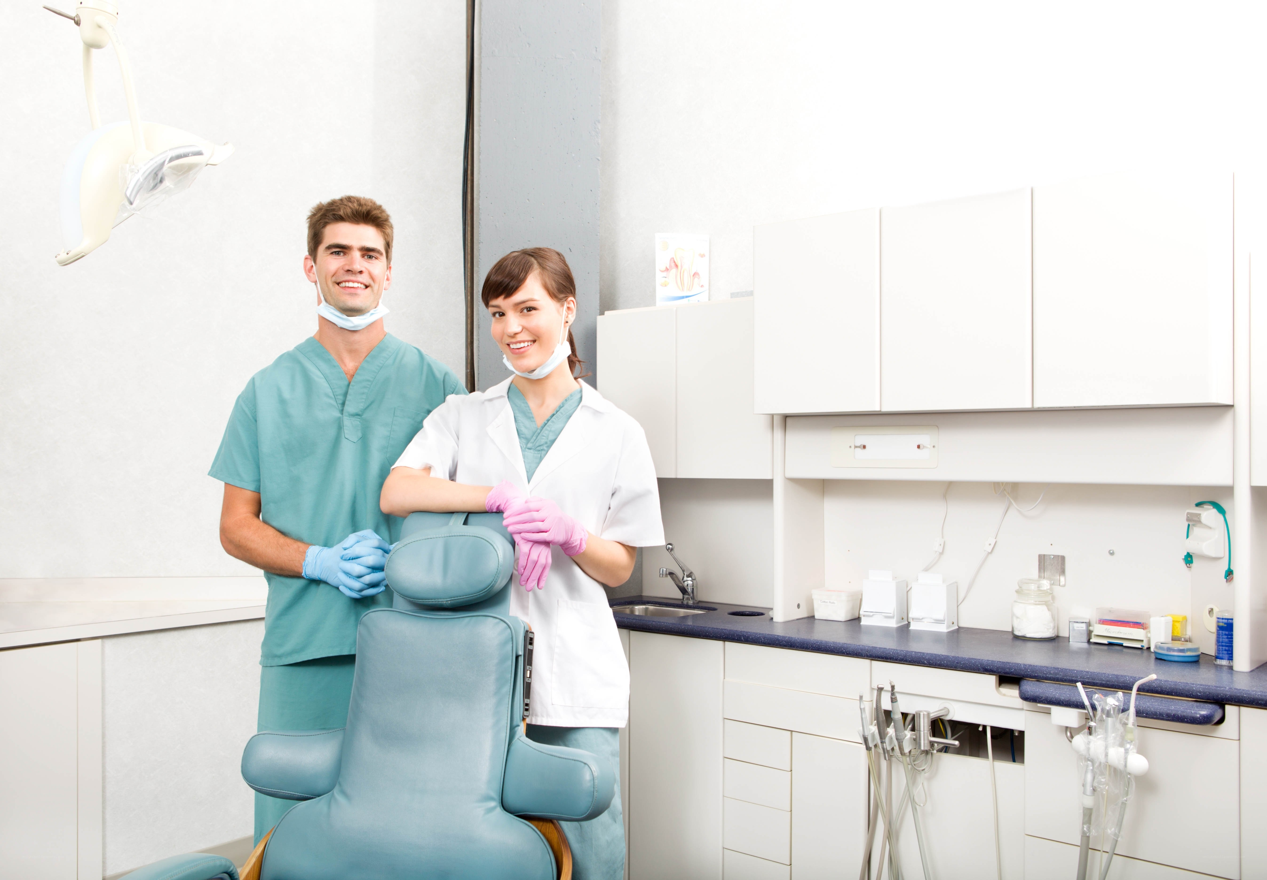 Dentist and assistant in clinic
