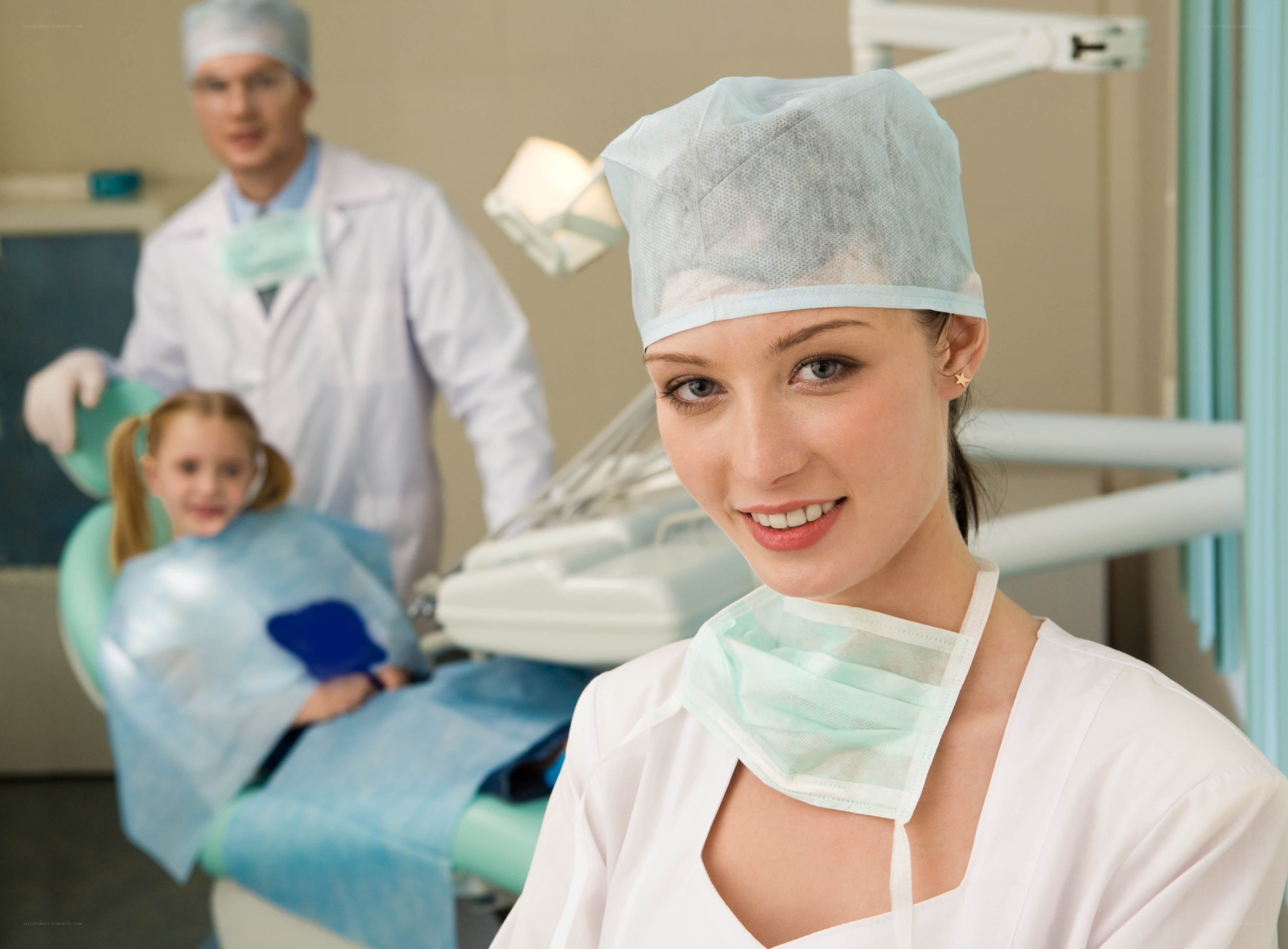Dentist with patient in clinic