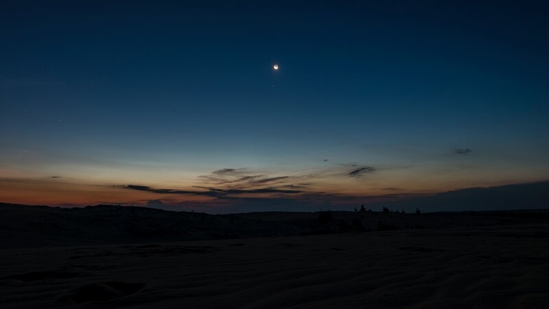 Desert at twilight with moon