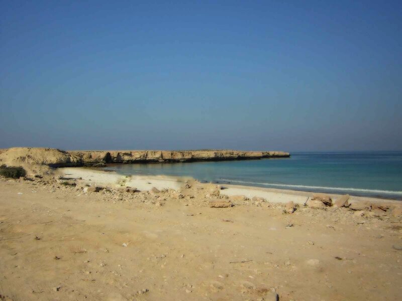 desert beach with rocky outcrop