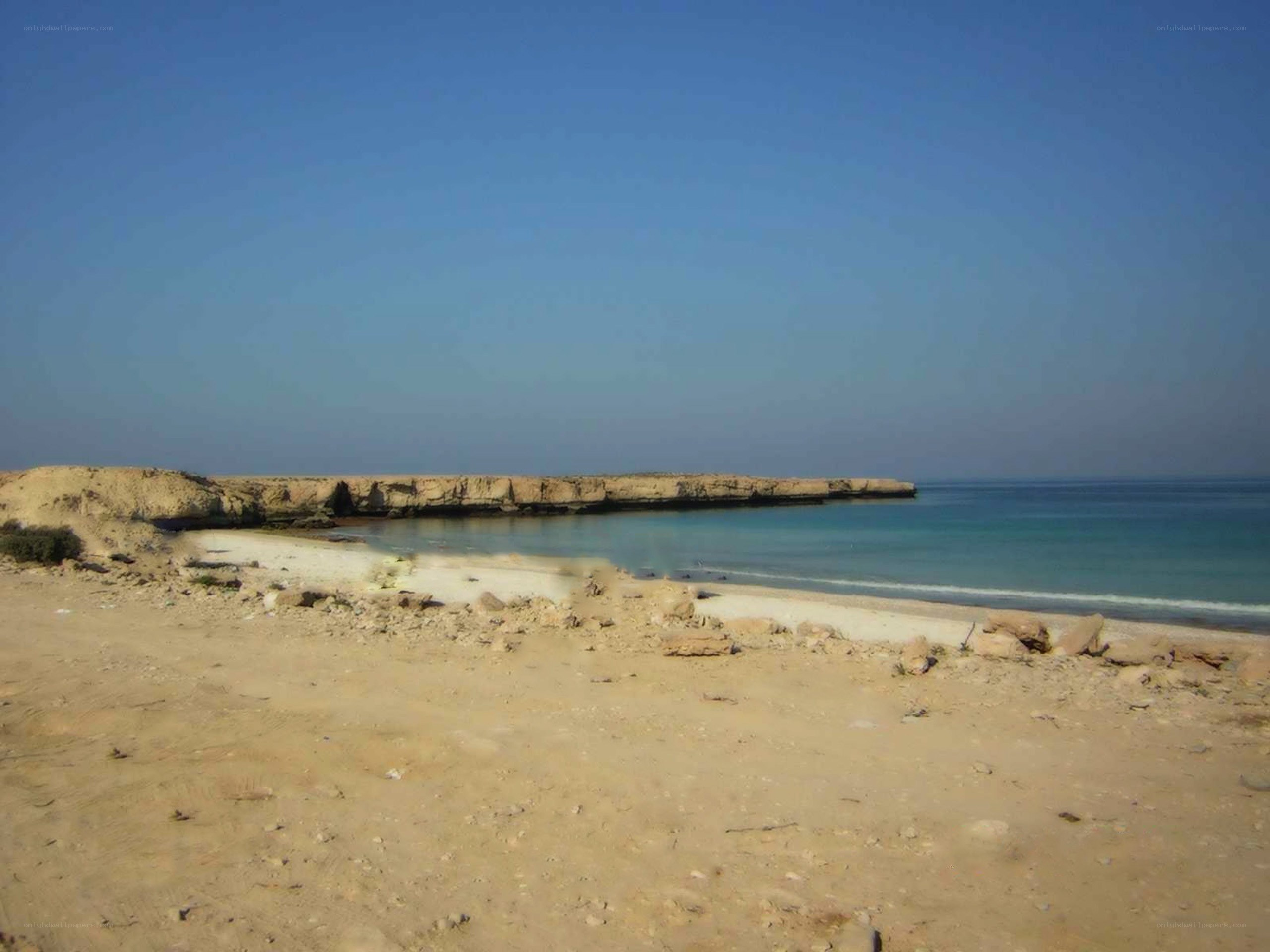 desert beach with rocky outcrop