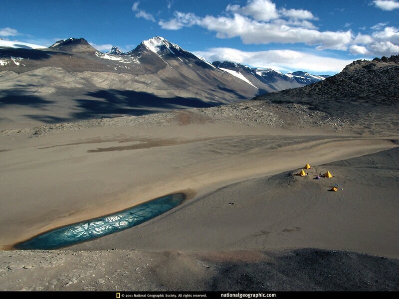 Desert camp with mountain backdrop