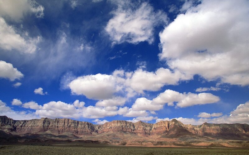 Desert canyon under cloudy sky