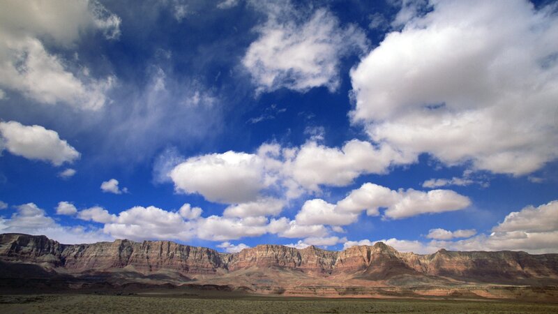 Desert canyon under cloudy sky