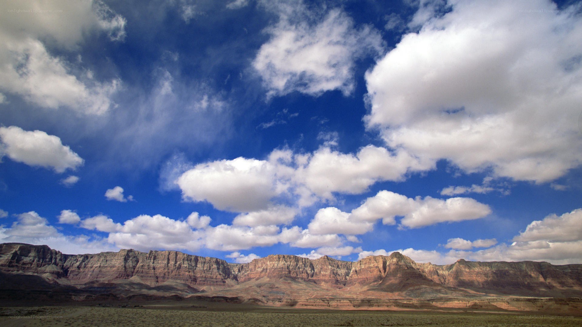Desert canyon under cloudy sky
