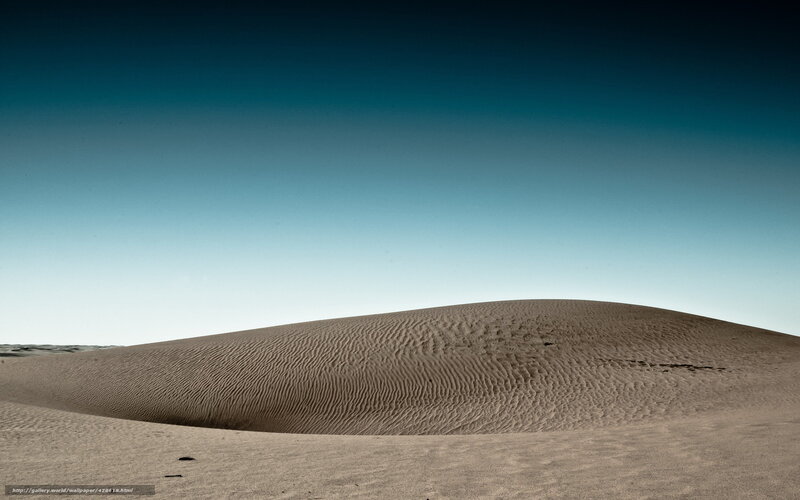 Desert dune under clear sky