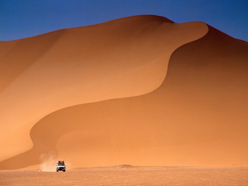 Desert dune with vehicle