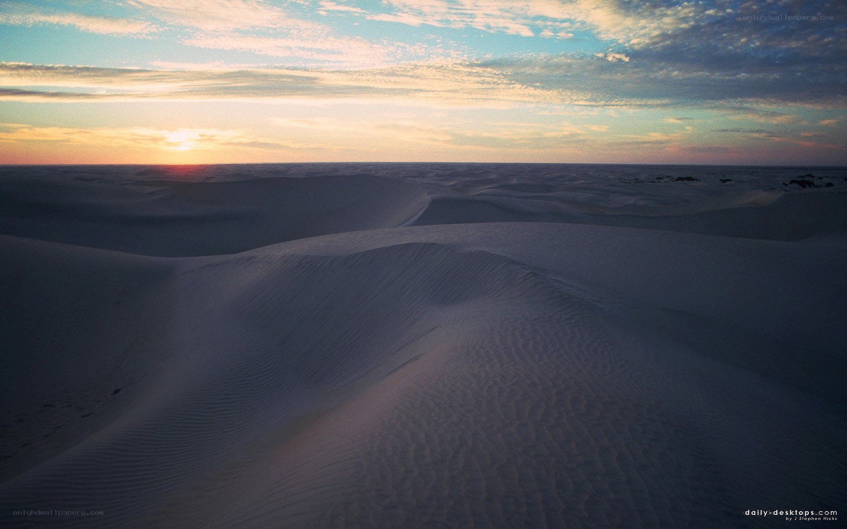 Desert dunes at sunset