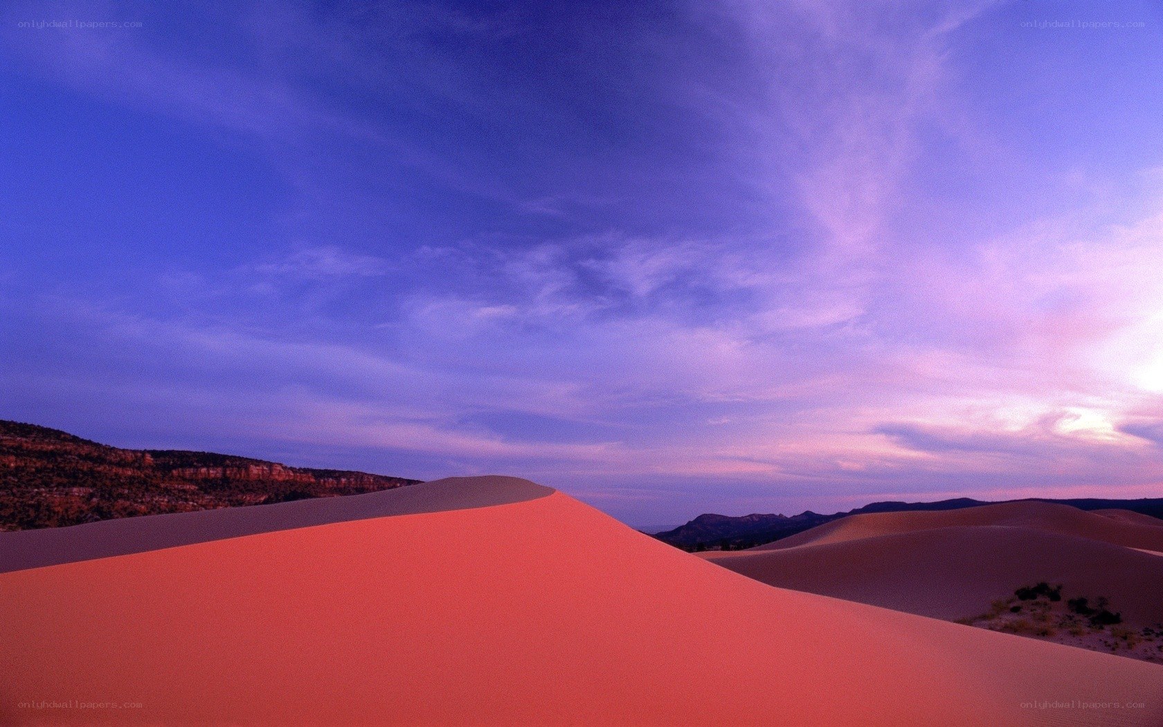 Desert dunes at sunset