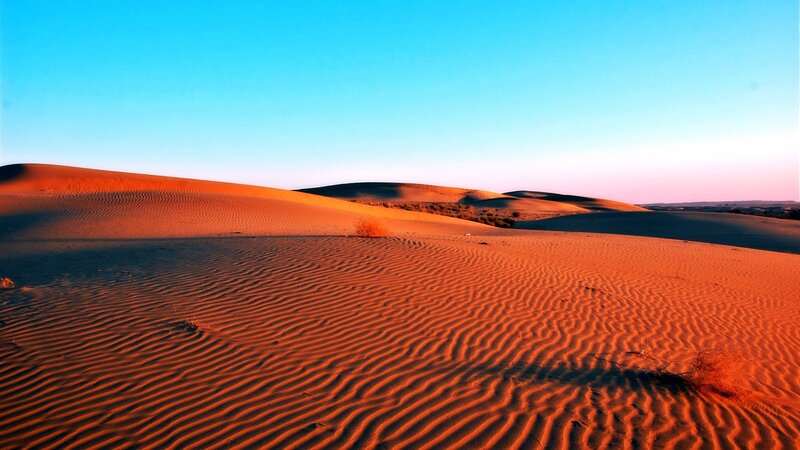 Desert dunes at sunset