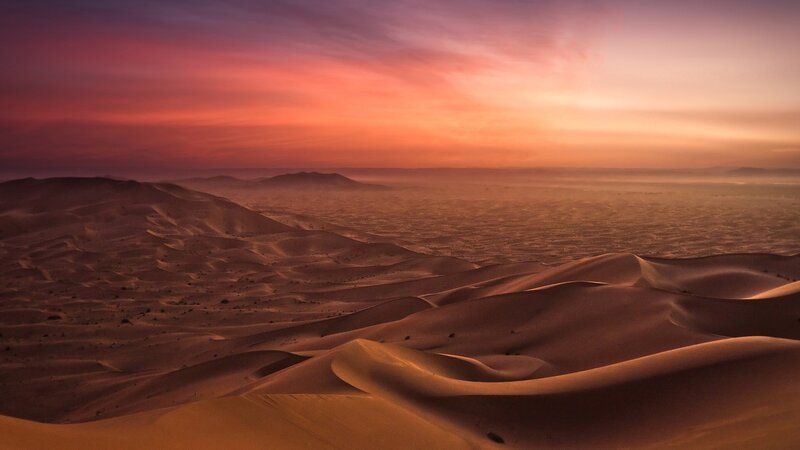 Desert dunes at sunset