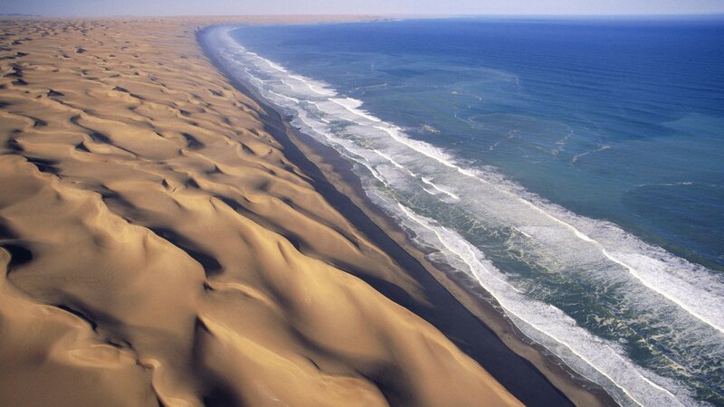Desert dunes meet ocean