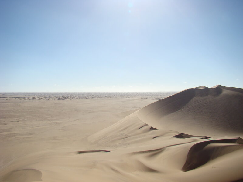 Desert dunes under a clear sky