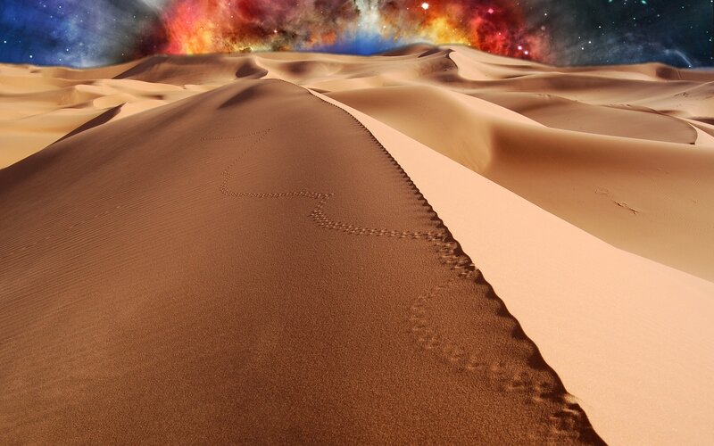 Desert dunes under a starry sky